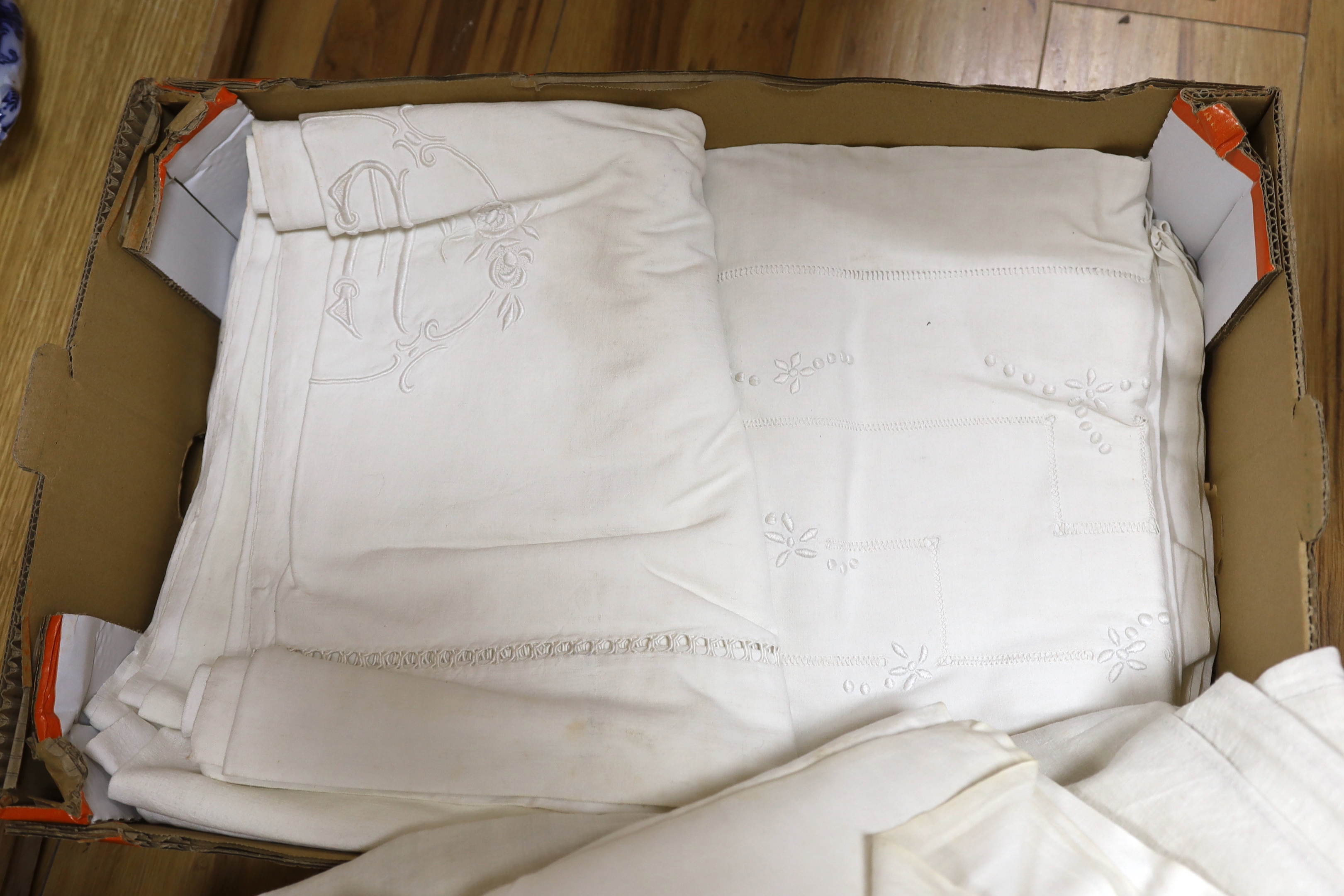 Six heavily embroidered French linen sheets